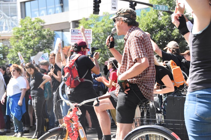 A protester with a speaker giving shit to Patriot Prayer supporters