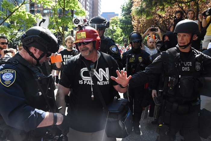 The guy in the CNN IS FAKE NEWS shirt antagonized people at the plaza