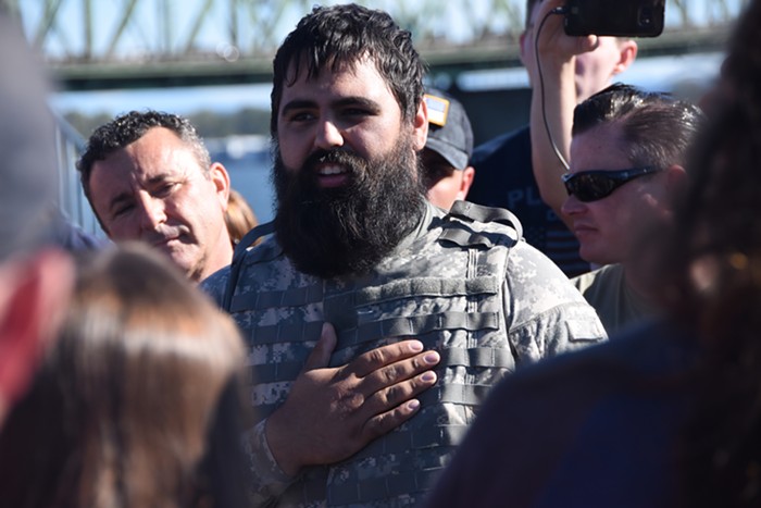 A patriot prayer supporter dressing like a soldier