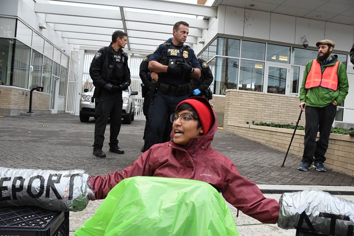 One of five members of a human chain in front of the ICE facility in Southwest Portland.