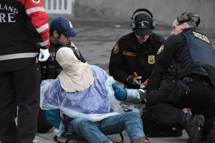 Portland police put hoods and headphones on Arrested Protesters