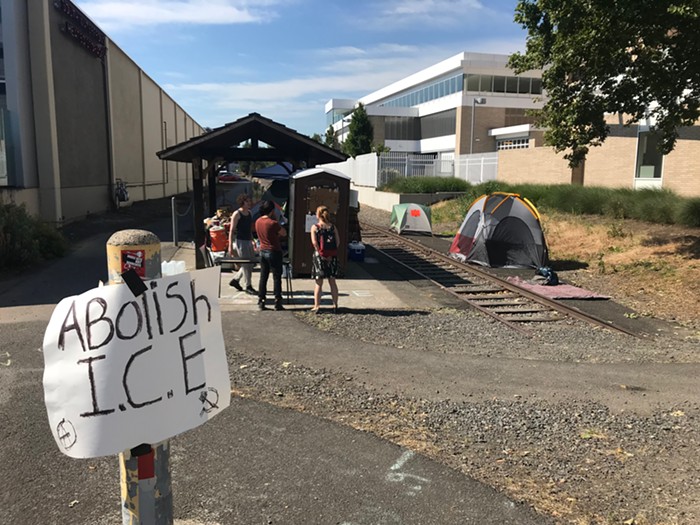 Several tents set up near the ICE building in South Portland