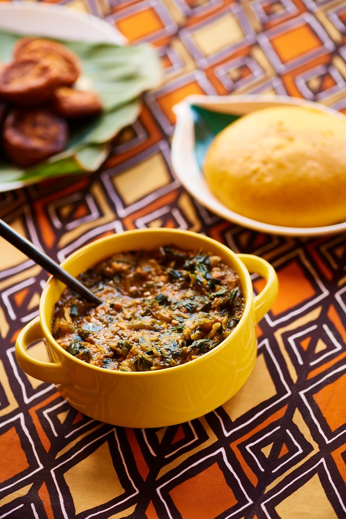 Akadis fried plantain cakes, fufu, and spicy okra and spinach with rice