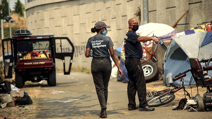 Portland Street Response staff distributing water to unhoused Portlanders during a heat wave