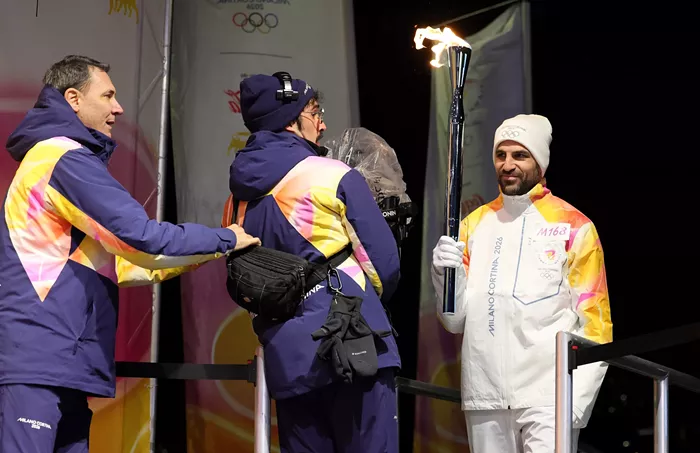 Good Morning, News: Trump-Loving Suspect Indicted for Police Shooting, 2026 Winter Olympics Begin Friday, and Is Oregon Ready for Waymos?