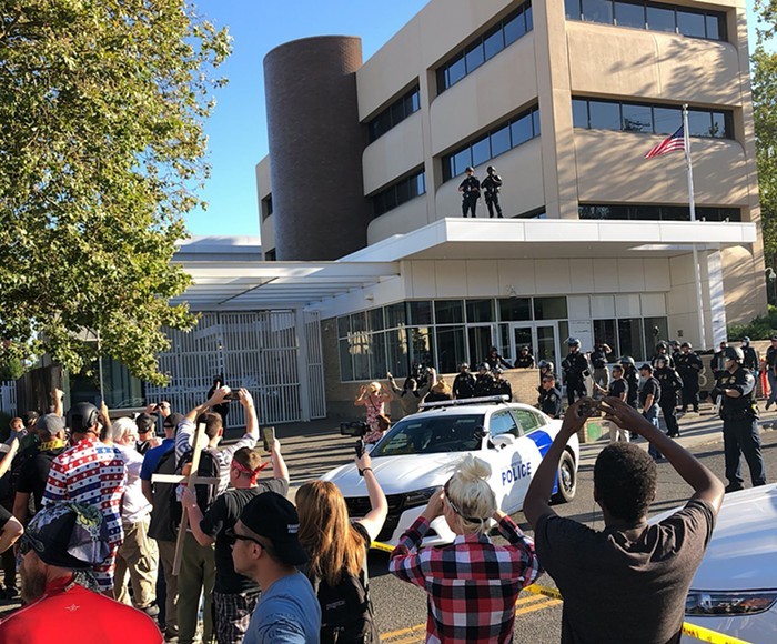 Protesters gather outside the Portland ICE building during 2018s Occupy ICE protests.