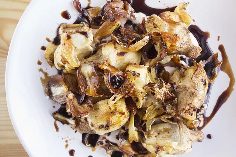 Fried artichokes aren't breaded, as you might anticipate. They're served with creamy stracciatella and balsamic vinegar. - MABEL SUEN