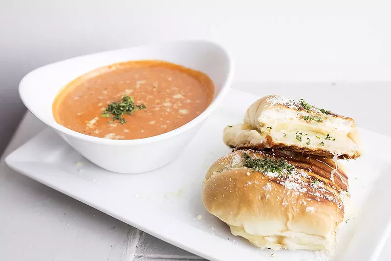 The quattro formaggi sandwich is stuffed with smoked scarmoza mozzarella, fontinella, parmigiana and mozzarella. - MABEL SUEN
