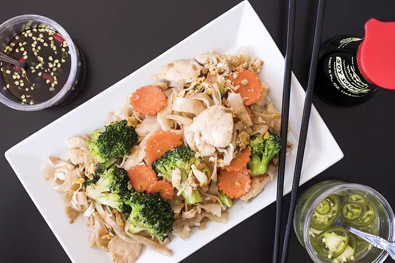 Pad see ew features wide rice noodles and vegetables stir-fried in a sweet, dark soy sauce. - MABEL SUEN