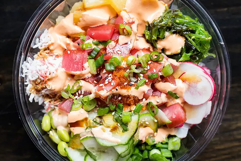 An ahi tuna poke bowl can be topped with cucumbers, edamame, crab meat, pineapple, radish, seaweed salad and green onion. - MABEL SUEN