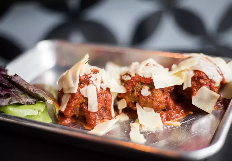 "Cherry Bombs" are stuffed with bleu cheese and cherry-pepper relish, topped with shaved Parmesan cheese. - MABEL SUEN