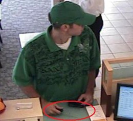 The blade of the knife appears to be parallel to the surveillance camera in this photo, though you can see the shadow of the knife against the counter.