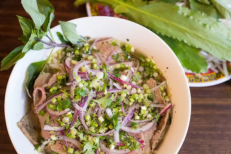 Pho dac biet combines rice noodles, beef meatballs, medium-rare sliced beef and brisket in a savory broth. - MABEL SUEN