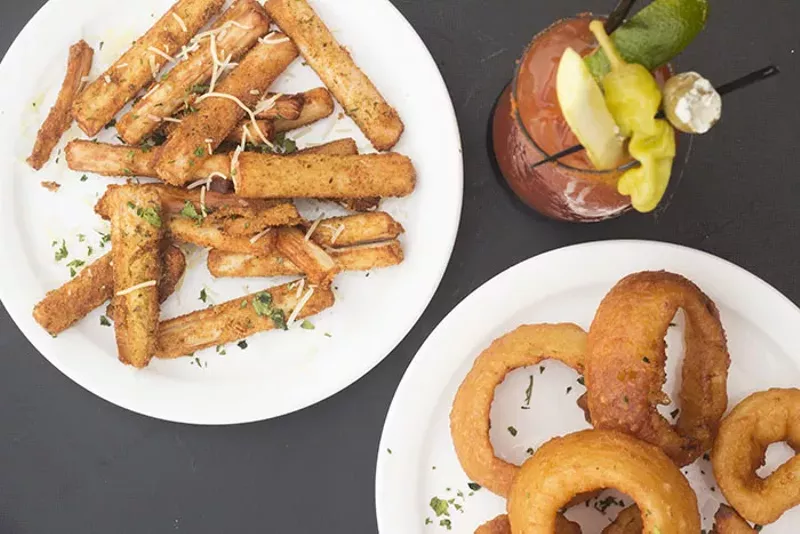 Appetizers include fried hearts of palm and onion rings. - MABEL SUEN