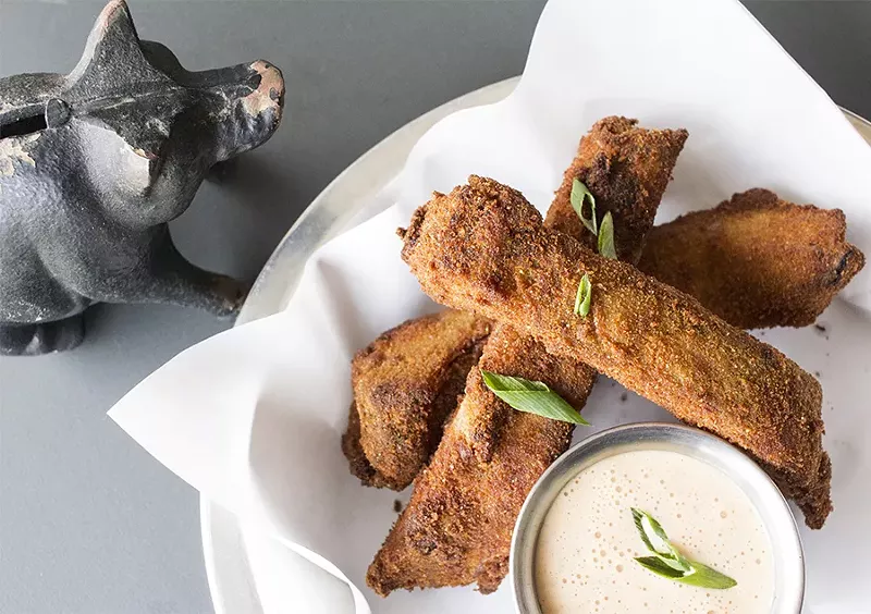 The fried ribs come with Alabama-style sauce. - PHOTO BY MABEL SUEN