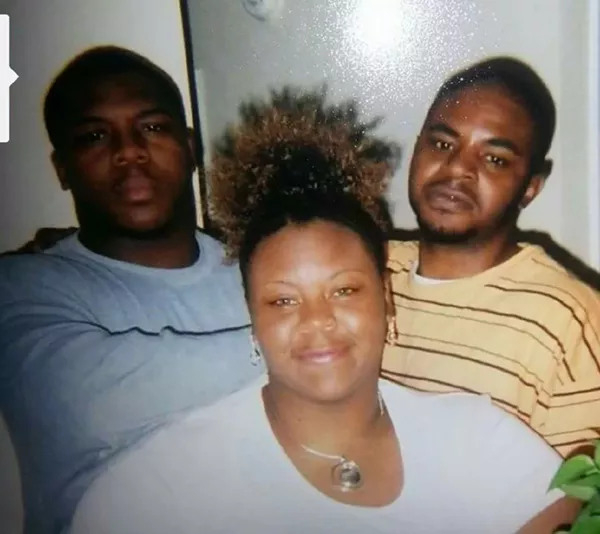 Robert Franklin (right) with his mother Dina and brother Raymond. The PPDO statute will keep him in prison for another 14 years. "I know I’m not going home," he says. - COURTESY OF DINA FRANKLIN