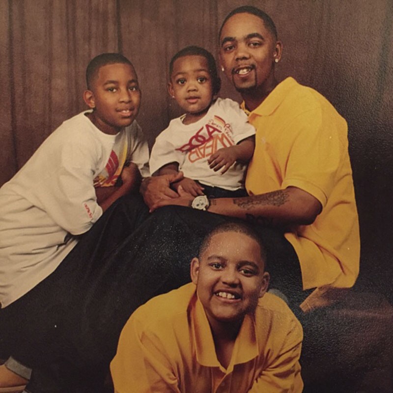 Dimetrious Woods with three of his six children, shown here in a picture taken one week before his 2007 trial. Woods was sentenced to 25 years without parole. - COURTESY OF AUNDREA RIFFLE