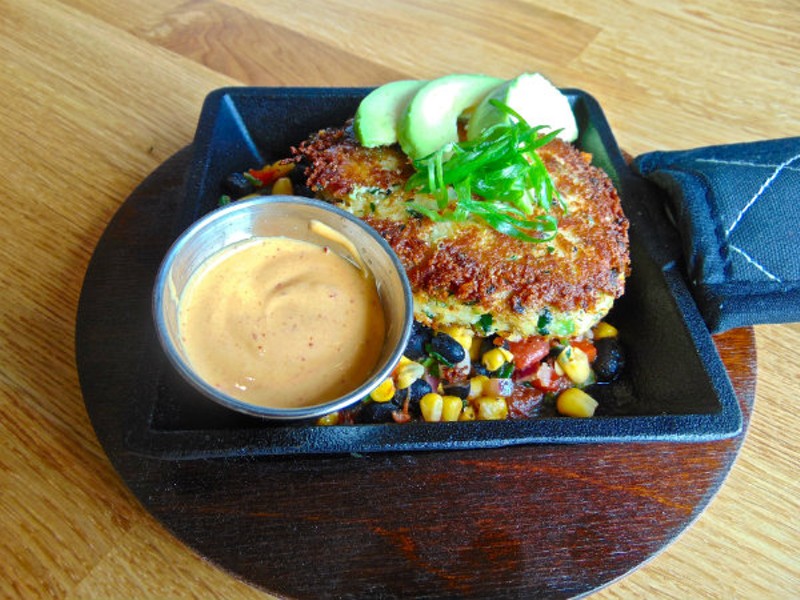 The wood-fired crab is made from crab in giant pieces and is served over a black bean, corn and tomato salsa.  Chipotle mayonnaise is served on the side.  - EMILY HIGGINBOTHAM