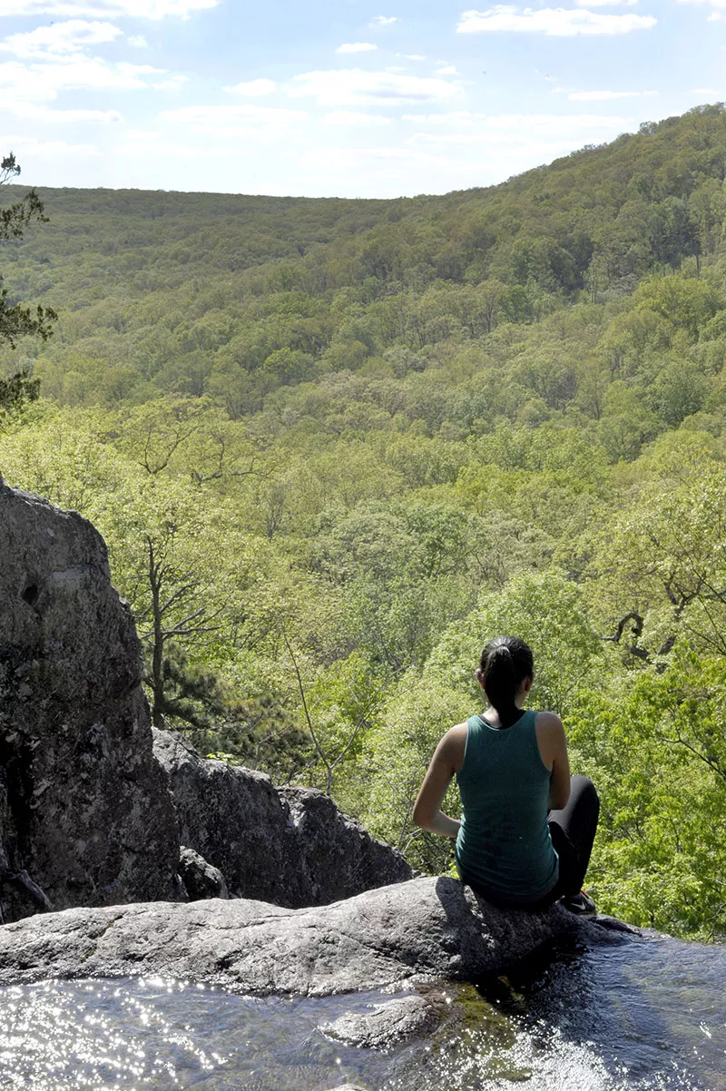 A hiker contemplates the view - PHOTO BY KELLY GLUECK