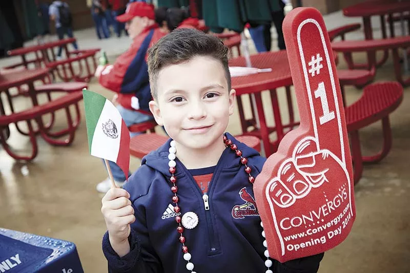 Fans braved the rain to watch Fiesta Cardinales. - PHOTO BY STEVE TRUESDELL