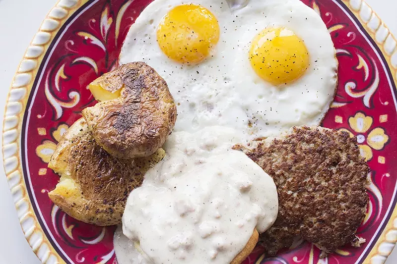 The "Classic Breakfast" comes with two eggs, bacon or sausage, smashed potatoes and a biscuit with gravy. - PHOTO BY MABEL SUEN