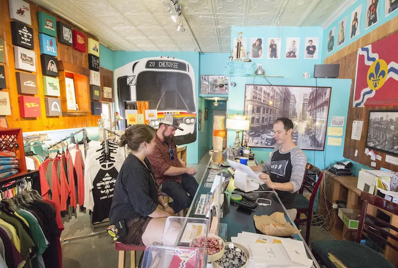 Coffey purchases post cards from STL-Style. - PHOTO BY MABEL SUEN