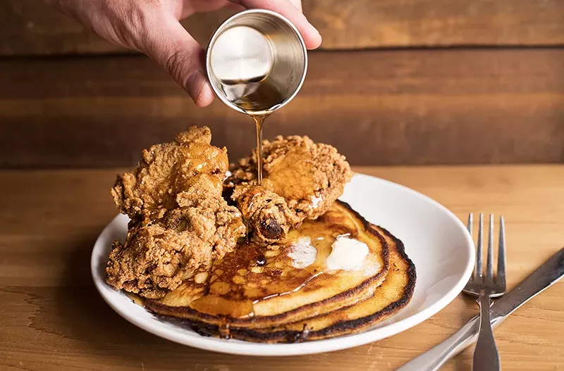Chef Ellis subs Johnny cakes for waffles, pairing them with fried chicken to delicious effect. - MABEL SUEN