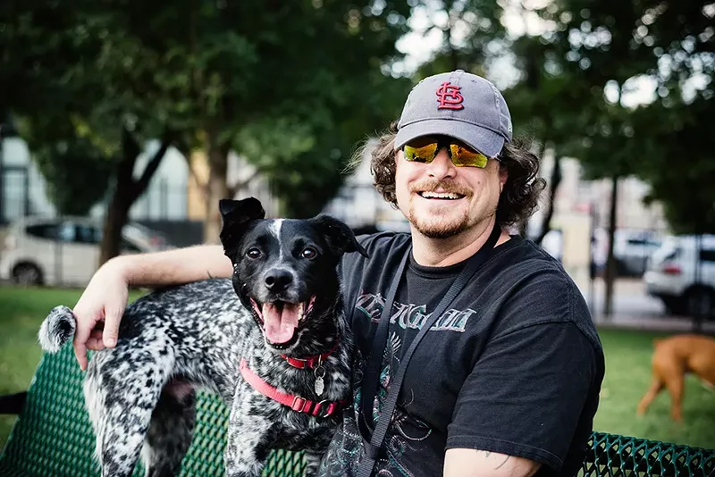Joshua Headley and Rocco take a break together. - STEPHEN KENNEDY