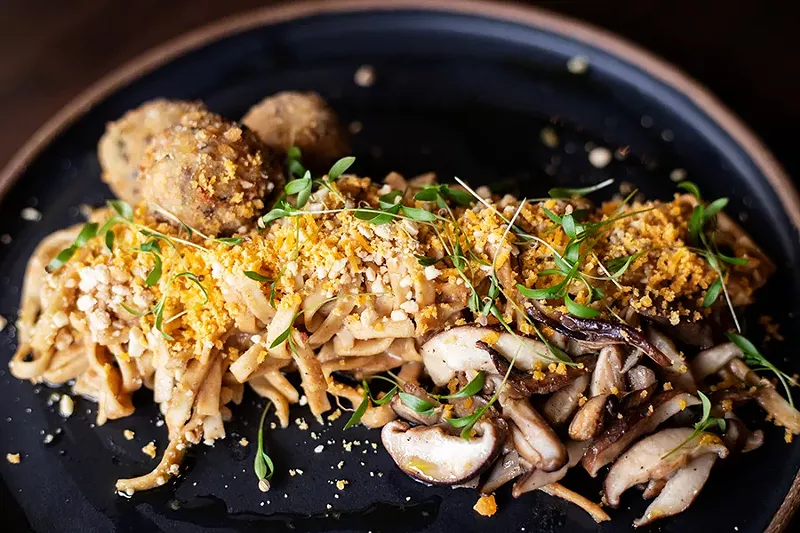 Mama Lee’s Noodles, which are a nod to the noodles Lee’s mother cooked to celebrate the Lunar New Year, are thick and slicked with peanut sauce. - MABEL SUEN