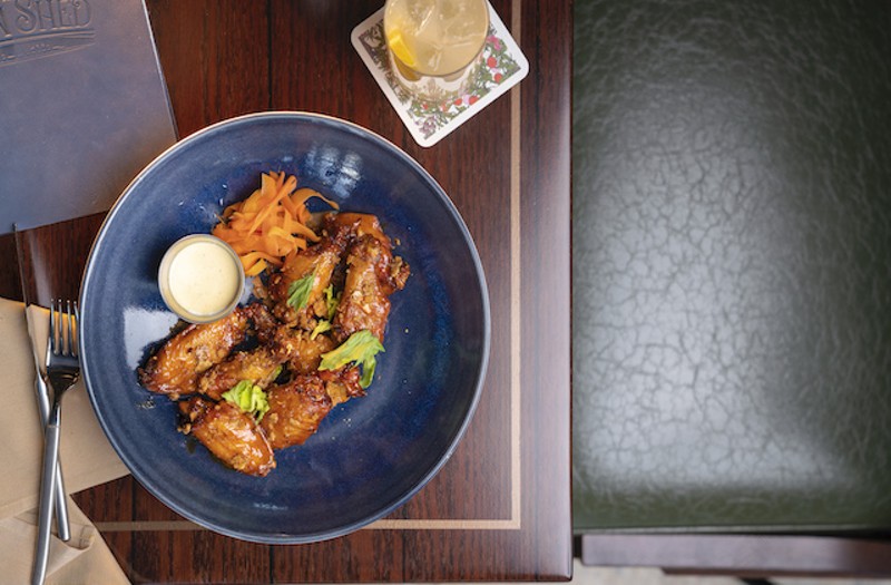 Smoked honey-Buffalo wings with pickled carrot, celery hearts, buttermilk dressing and blue cheese crisps. - COURTESY OF LODGING HOSPITALITY MANAGEMENT