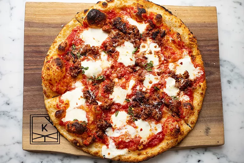 The Salsiccia pizza comes topped with house salsiccia sausage, tomato, mozzarella and oregano. - MABEL SUEN