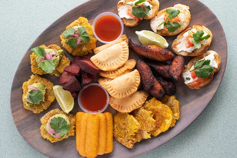 The restaurant’s appetizer sampler features tostones with avocado, fried salami, cheese empanadas, maduros, Cuban bruschetta and sorullitos. - MABEL SUEN