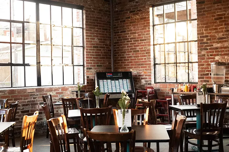 A lot of the restaurant’s buzz relates to the space itself, divided into a takeout counter and pizza kitchen on one side and the main dining room and bar on the other. - MABEL SUEN