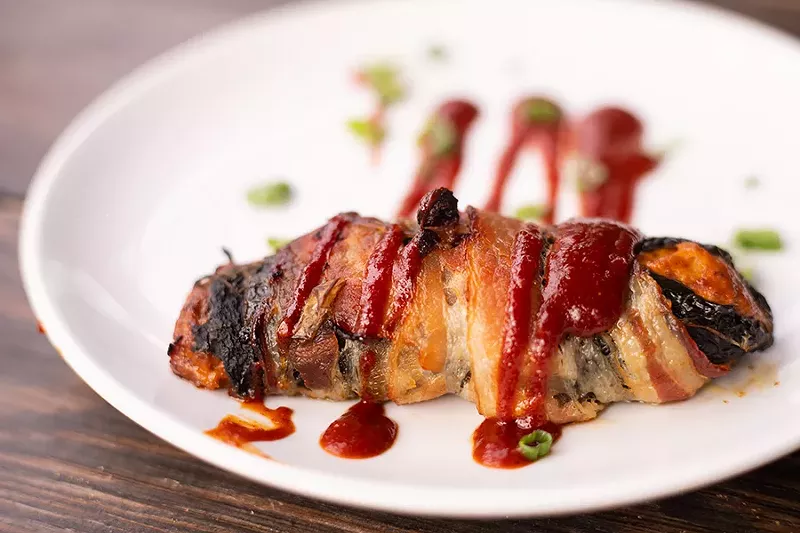 The Texas Twinkie wraps a poblano in bacon and stuffs it with brisket and cream cheese. - MABEL SUEN