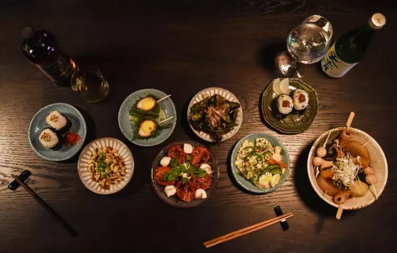 An overhead view of seven of the shareable plates at Takashima. - TRENTON ALMGREN-DAVIS