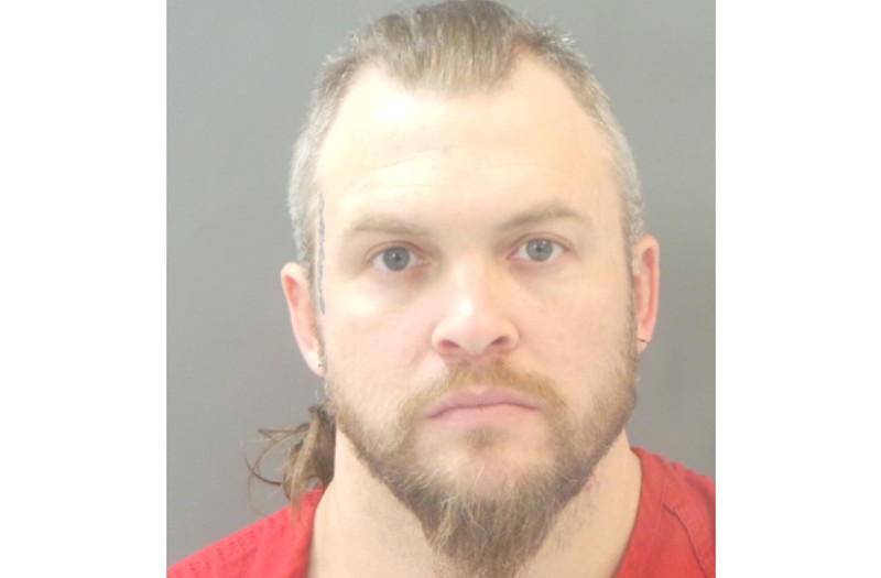 Justin Neilson's booking photo prior to his arrest last October. - ST. LOUIS METROPOLITAN POLICE DEPARTMENT