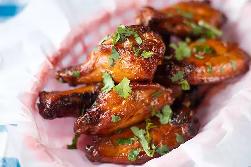 Smoked wings with lime, agave, arbol pepper and cilantro. - MABEL SUEN