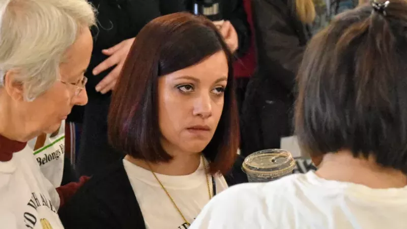 Carly Garcia tears up after learning ICE wouldn't review her husband's application for a stay of deportation. - DOYLE MURPHY