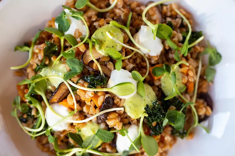 Grain salad with sweet potato, butternut squash, kale, shiitake mushrooms, goat cheese, green goddess and pea shoots. - MABEL SUEN