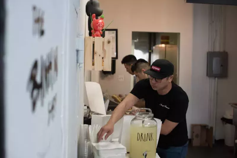 Owner Jimmy Trinh working in the kitchen. - TRENTON ALMGREN-DAVIS