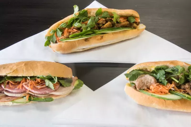 Sandwiches pictured from left to right: the Saigon Classic, grilled pork and lemongrass chicken. - TRENTON ALMGREN-DAVIS