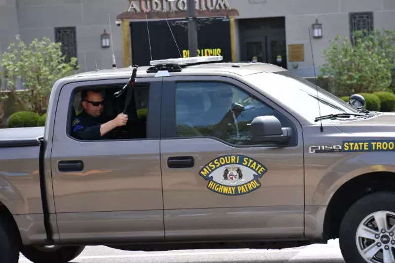 Missouri state troopers keep an eye on the homeless camp in downtown St. Louis. - DOYLE MURPHY
