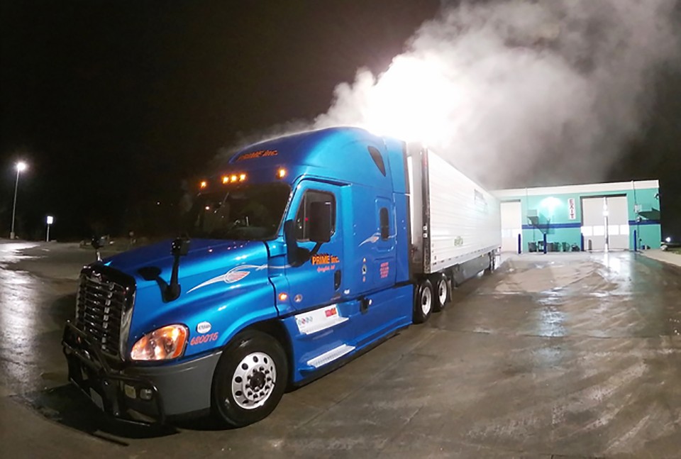 Steam rises from Chet Gordon's truck and trailer after being washed at 1 a.m. at the Blue Beacon Truck Wash in Antioch, Tennessee, on Saturday morning, February 15. - CHET GORDON