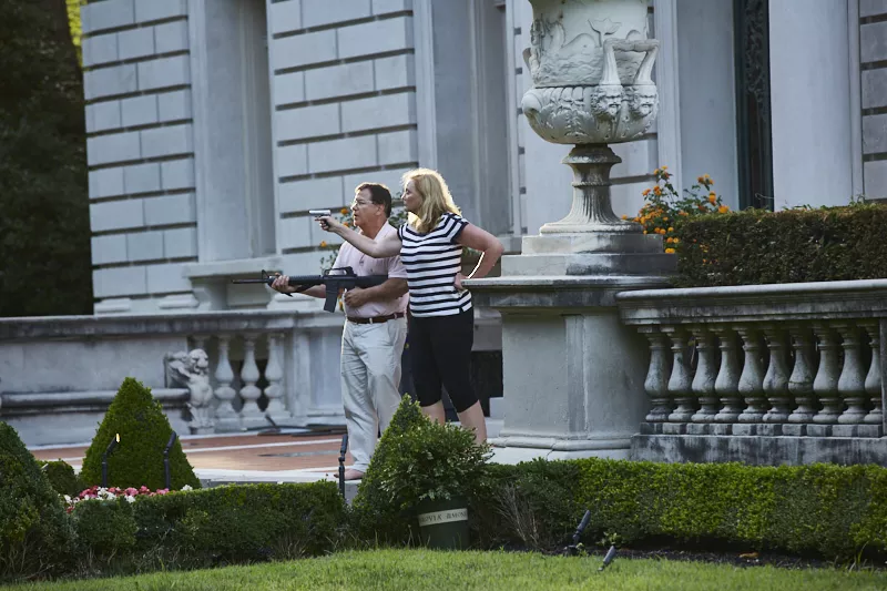 Patricia and Mark McCloskey in front of their home in the Central West End. - THEO WELLING