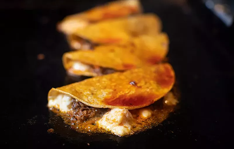 Quesabirrias on the grill. - MABEL SUEN