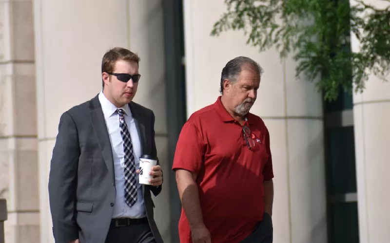 Ex-St. Louis police officer Chrisopher Myers (left) arrives at court on June 17. - DOYLE MURPHY