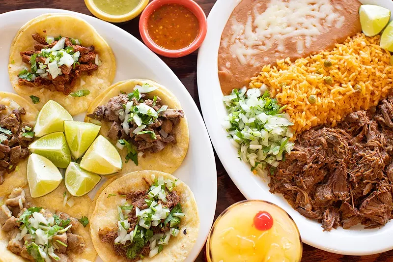 Al pastor (marinated pork), asada (steak), lengua (tongue), tripas (tripe) and barbacoa (shredded beef) tacos alongside barbacoa platillo. - MABEL SUEN