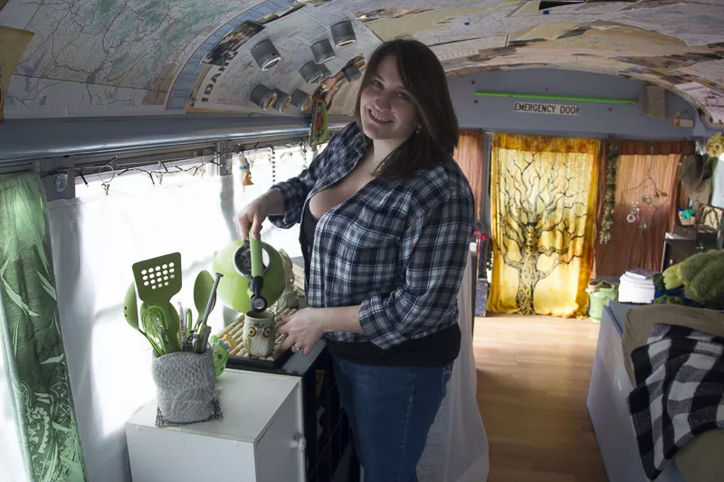Jamie Hill insider her 25-foot bus, Wanda. - PHOTO BY ALLISON BABKA