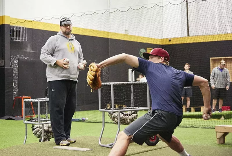 Luke Layton, a senior at MICDS, works his arm at P3. - STEVE TRUESDELL