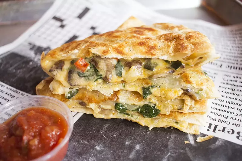 The spinach and mushroom quesadilla comes with salsa roja and avocado-lime crema. - PHOTO BY MABEL SUEN